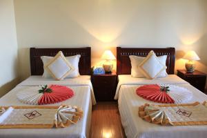 Postel nebo postele na pokoji v ubytování TIEN DAT MUI NE Resort & Spa