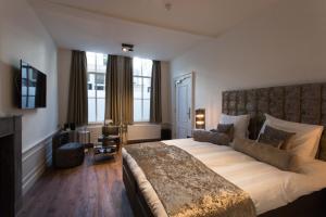 Katil atau katil-katil dalam bilik di Boutique Hotel Steenhof Suites - Adults Only