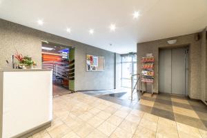 a lobby of a store with a counter at SportHotel in Liepāja