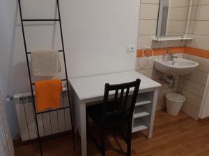a bathroom with a white desk and a sink at al 106 in Trieste
