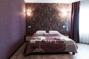 Postel nebo postele na pokoji v ubytování Noy Hotel