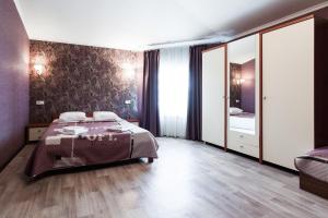 Postel nebo postele na pokoji v ubytování Noy Hotel