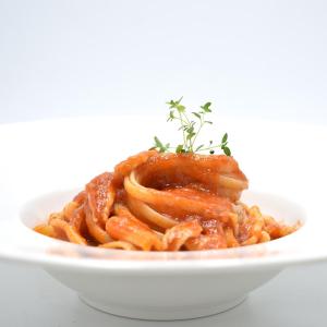 a plate of pasta with meat and sauce at Hotel Soresina in Soresina