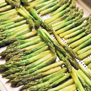 a bunch of green asparagus on a table at Hotel Soresina in Soresina