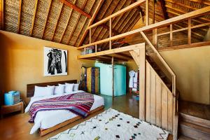 a bedroom with a bed and a loft at Westpoint Dakhla in Dakhla