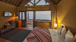 a bedroom with a bed with a view of the ocean at Westpoint Dakhla in Dakhla