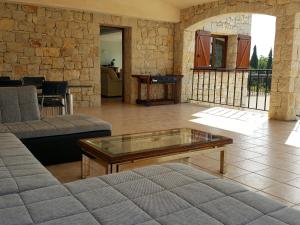 a living room with a couch and a coffee table at Villa Lavendel in Montauroux