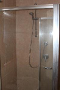 a shower with a shower head in a bathroom at Agriturismo Silos Agri in San Severo