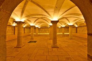 an arcade with columns and ceilings in a building at Pestana Cidadela Cascais - Pousada & Art District in Cascais
