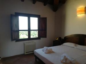 Postel nebo postele na pokoji v ubytování Hotel Punta Moros