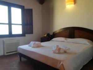 Postel nebo postele na pokoji v ubytování Hotel Punta Moros