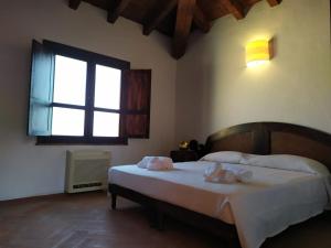 Postel nebo postele na pokoji v ubytování Hotel Punta Moros