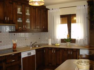 A cozinha ou cozinha compacta de CASA RURAL CASA CANDI