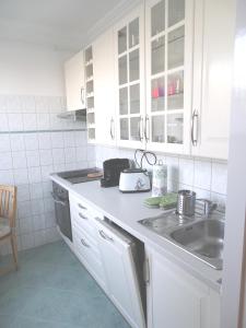 Kuchyň nebo kuchyňský kout v ubytování Duna View Apartment