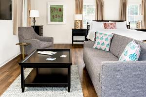 a living room with a couch and a bed at The Ellery in Northampton