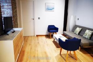 Posezení v ubytování Apartamento Llerandi 1B - Céntrico y completamente reformado