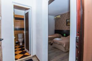 A bed or beds in a room at Vida Family Hotel