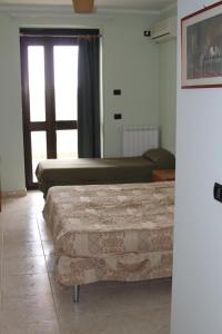 A bed or beds in a room at Agriturismo Silos Agri