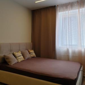 Ένα ή περισσότερα κρεβάτια σε δωμάτιο στο Апартаменты Дворец Спорта Новострой Маршал
