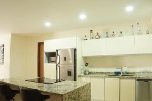 Η κουζίνα ή μικρή κουζίνα στο Hermoso Apartamento con Piscina/RoofGarden/Ac/ en Sayulita.