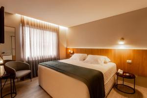 Postel nebo postele na pokoji v ubytování Hotel Melo