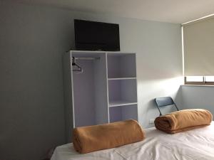 Postel nebo postele na pokoji v ubytování Hotel Garden City Boutique