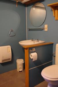 a bathroom with a sink and a mirror at Au Beolin in Houffalize