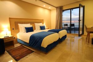Postel nebo postele na pokoji v ubytování Hotel Cote ocean Mogador