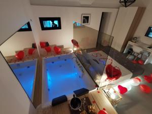 an aerial view of a living room with a swimming pool at Le Dimore Degli Archi Catania in Catania