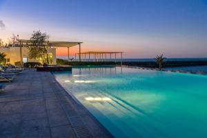 The swimming pool at or near Nurai Luxury Sea front villa
