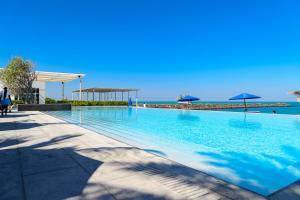The swimming pool at or near Nurai Luxury Sea front villa