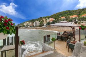 a view of a beach with a restaurant and the water at Marine Hotel & Apartment in Vung Tau