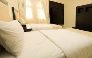 Katil atau katil-katil dalam bilik di Remas Hotel Suites - Al Khoudh, Seeb, Muscat