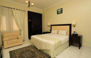 Katil atau katil-katil dalam bilik di Remas Hotel Suites - Al Khoudh, Seeb, Muscat