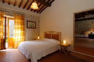 Postel nebo postele na pokoji v ubytování Agriturismo Montecchio + 21 fotografií