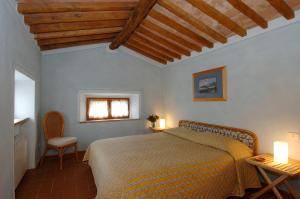 Postel nebo postele na pokoji v ubytování Agriturismo Montecchio