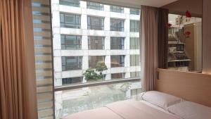 Postel nebo postele na pokoji v ubytování K Hotel Tianjin