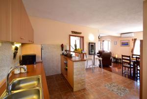 a kitchen with a sink and a counter top at VILLA DINJA in Gizdavac