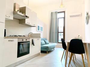 A kitchen or kitchenette at Indipendenza Luxury Apartments