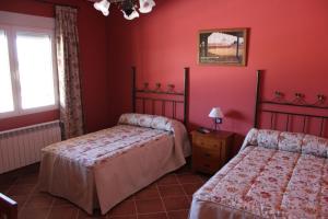 Säng eller sängar i ett rum på Casa Rural La Florentina
