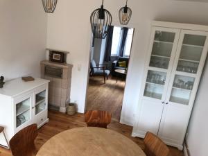 a living room with a table and a dining room at Haus Schönkamp in Lübeck