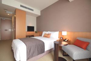 Postel nebo postele na pokoji v ubytování Hotel Arc Riche Toyohashi