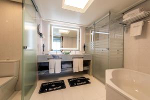 a bathroom with a sink, toilet and bathtub at Santemar in Santander
