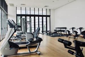 a gym with several treadmills and exercise bikes at Damai 88 by Moka near KLCC in Kuala Lumpur