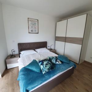 Postel nebo postele na pokoji v ubytování Blue Water Apartment
