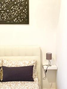 A bed or beds in a room at Indipendenza Luxury Apartments