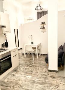 A kitchen or kitchenette at Indipendenza Luxury Apartments