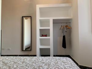 A bed or beds in a room at Indipendenza Luxury Apartments