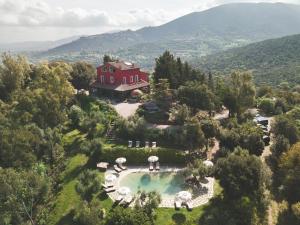 an aerial view of a house with a swimming pool at Be Vedetta - Relais & Glamping - Adult Only in Scarlino