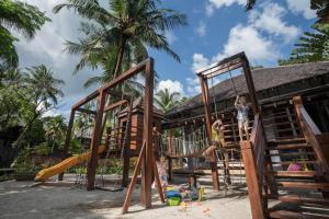a group of children playing in a playground at Four Seasons Resort Langkawi in Tanjung Rhu